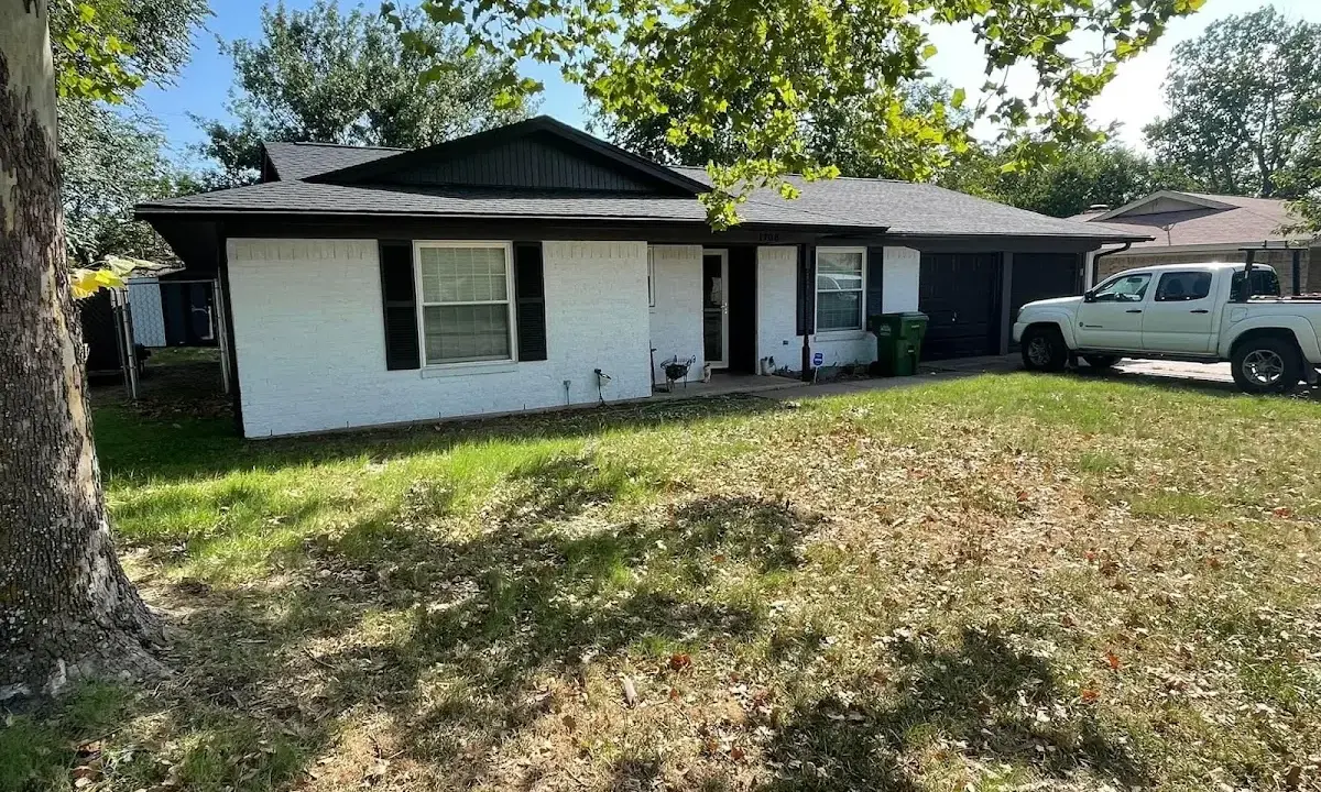Professional roofing crew working on a residential roof in Baldwin City